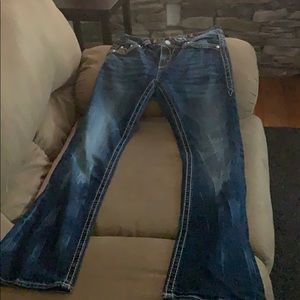 Medium wash RR. Red plaid under distressed pocket